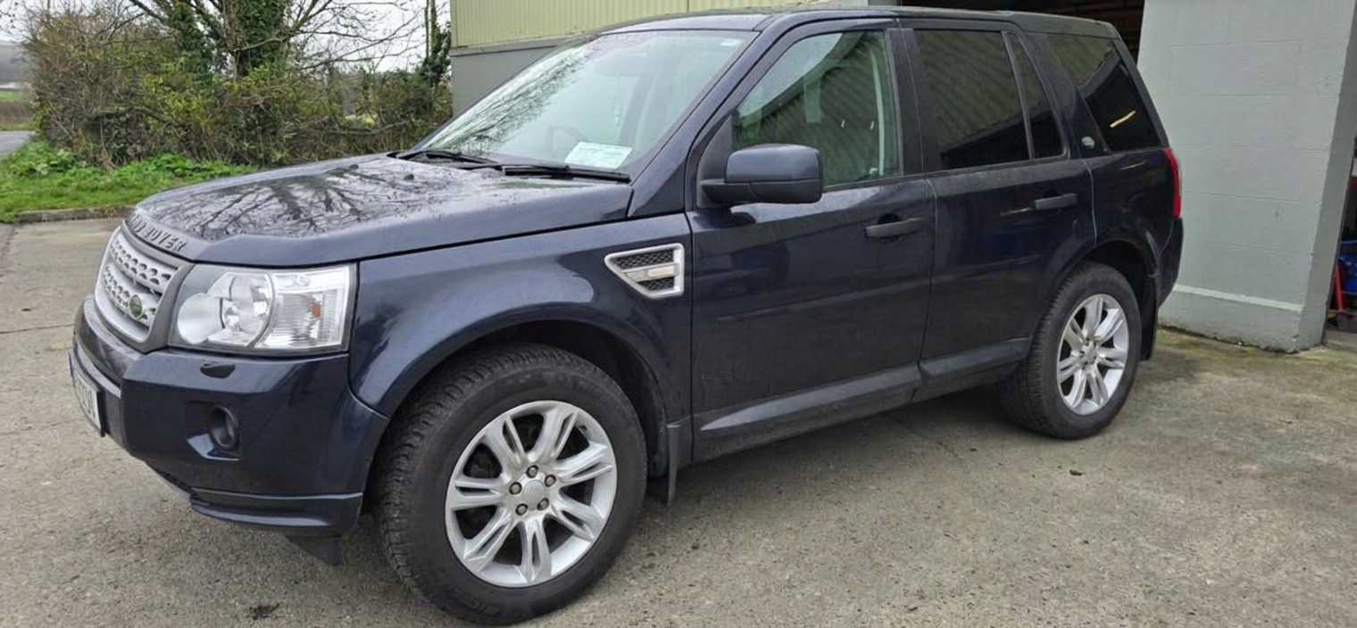 Front-left three-quarter view of a Land Rover Freelander 2 after window tinting