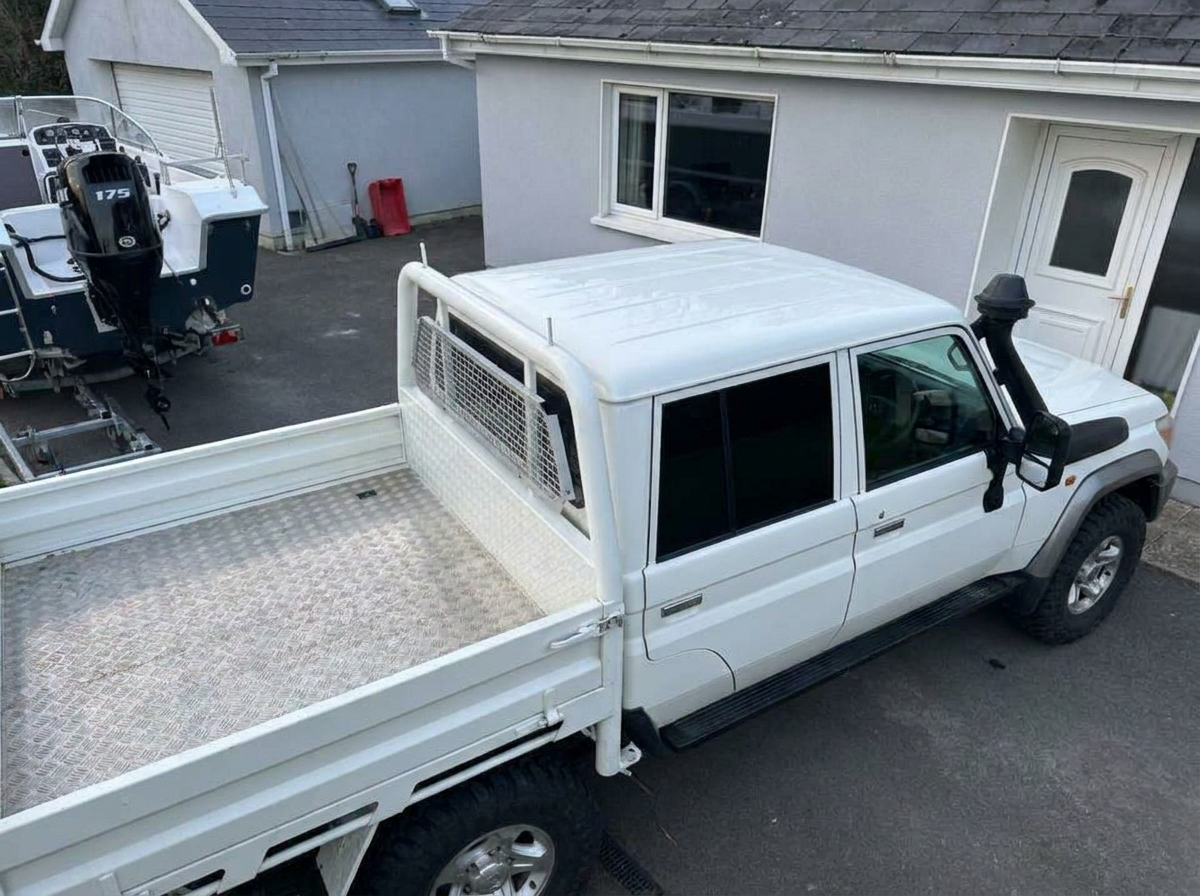 High angle view of a Land Cruiser crew cab showing dark tinted glass