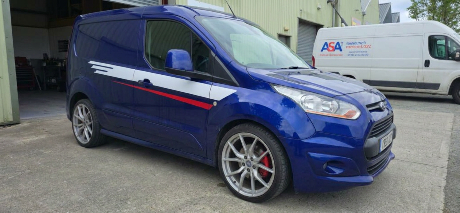 Front-left view of a tinted blue Ford Transit Connect Sport van