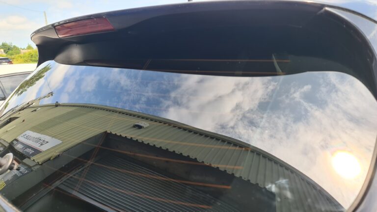 Tinted curved rear screen with heater lines intact after a heat-shrink fit