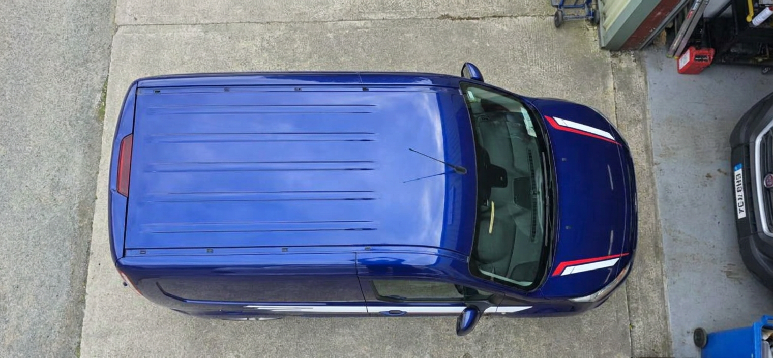 Top-down view of a blue Ford Transit Connect Sport van roof and tinted windscreen area