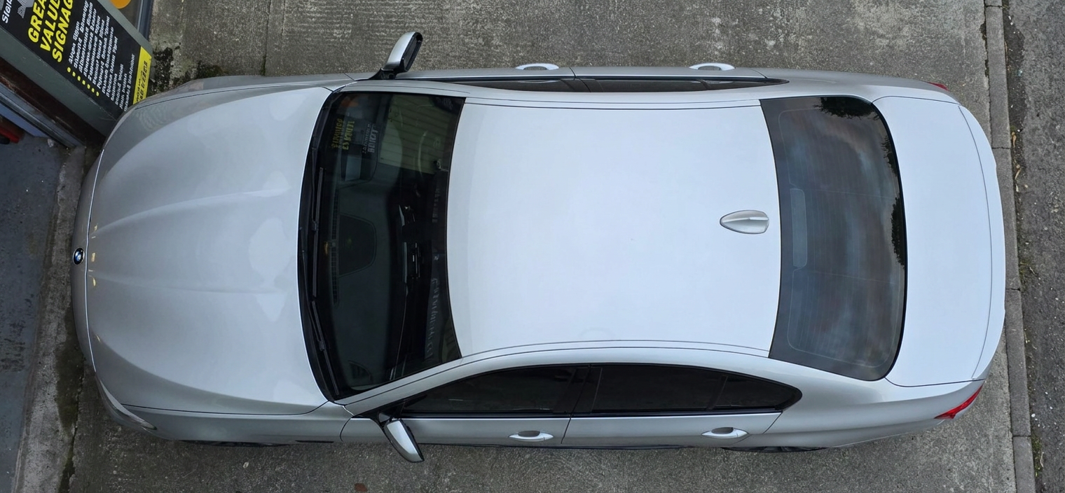 Top-down view of a tinted sunroof and rear screen